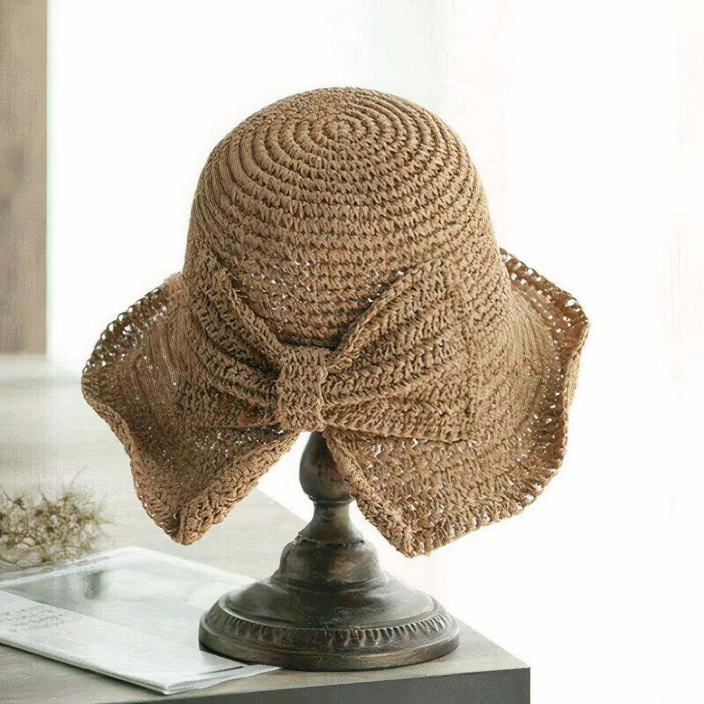 Opvouwbare dames zomerhoed met strik, stijlvol accessoire, zacht en milieuvriendelijk.
