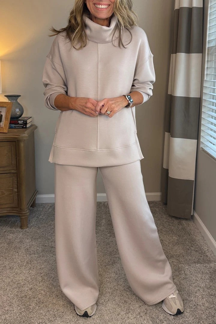 Zachte oranje dameskleding set: oversized trui en joggingbroek. Perfecte casual loungewear tweedelig voor vrouwen.