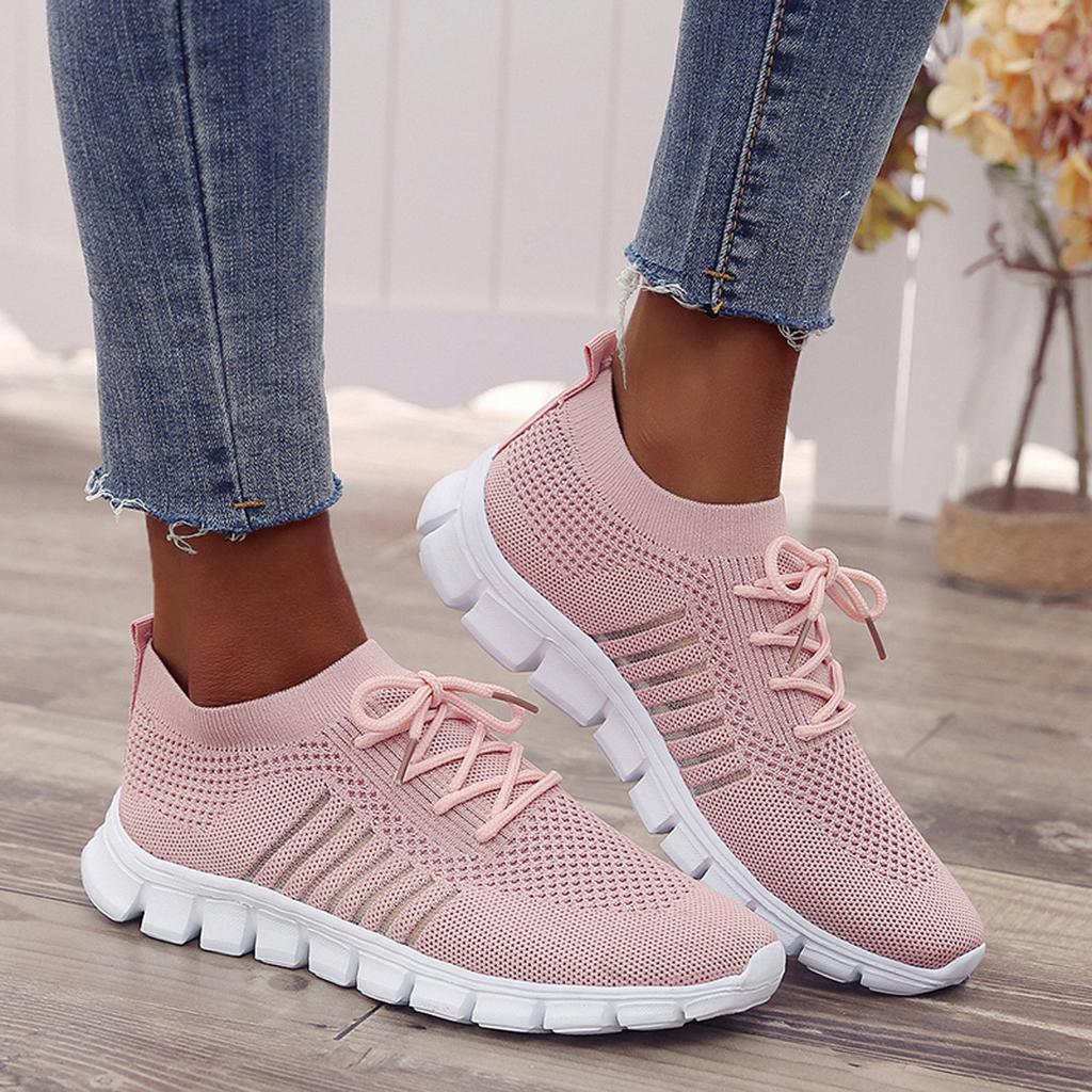 Stapel van diverse kleuren orthopedische dames sneakers: zwart, grijs, beige, geschikt voor casual en sportief.