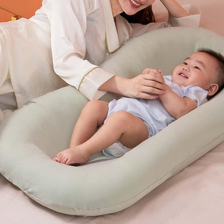 "Pastel baby lounger kussen van zacht katoen, veilige nest voor baby's 0-24 maanden, ademend en ergonomisch ontwerp."