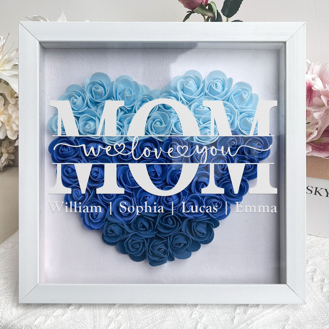 Unieke gepersonaliseerde shadowbox voor Moederdag, met namen en bloemen. Perfect familiegeschenk.