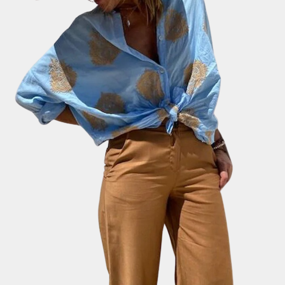 "Prachtige damesblouse met lange mouwen, unieke print en levendige kleuren, ideaal voor elke gelegenheid."