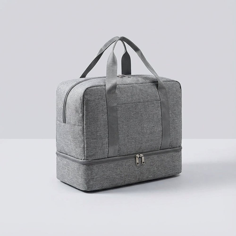 Grijze waterdichte reistas, type Stowport, met speciaal schoenenvak. Ideaal als handbagage.