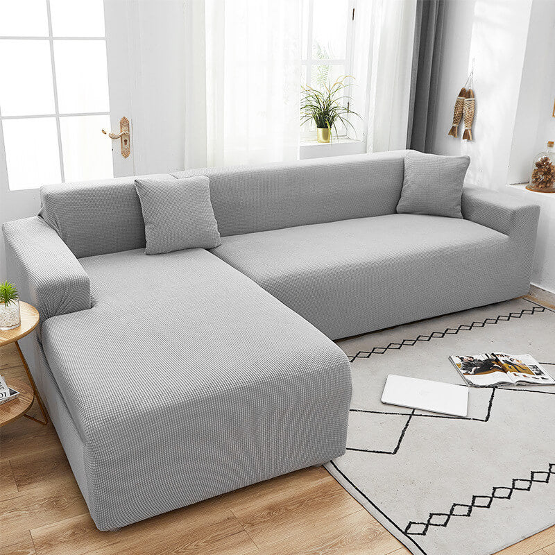 "Rekbare bankhoes met strakke pasvorm, elastisch materiaal in stijlvol design, beschermt tegen vlekken en huisdierharen."