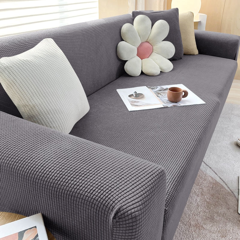 "Rekbare bankhoes met strakke pasvorm, elastisch materiaal in stijlvol design, beschermt tegen vlekken en huisdierharen."
