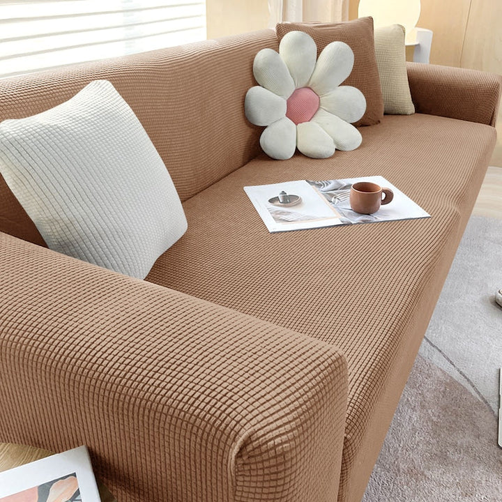"Rekbare bankhoes met strakke pasvorm, elastisch materiaal in stijlvol design, beschermt tegen vlekken en huisdierharen."