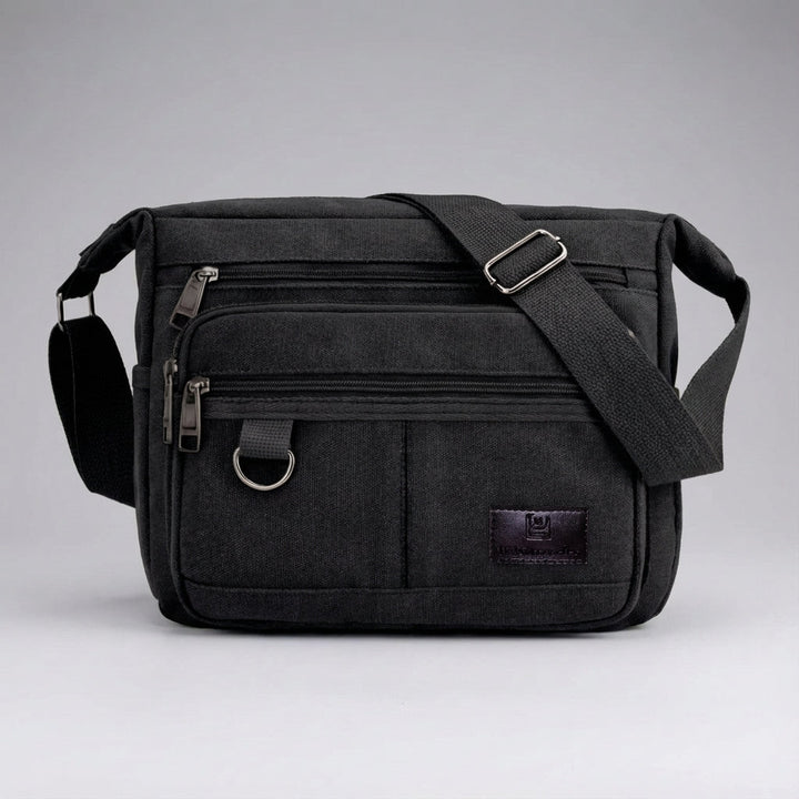 Duurzame canvas laptoptas in messenger stijl, ontworpen voor comfort en veilige organisatie.