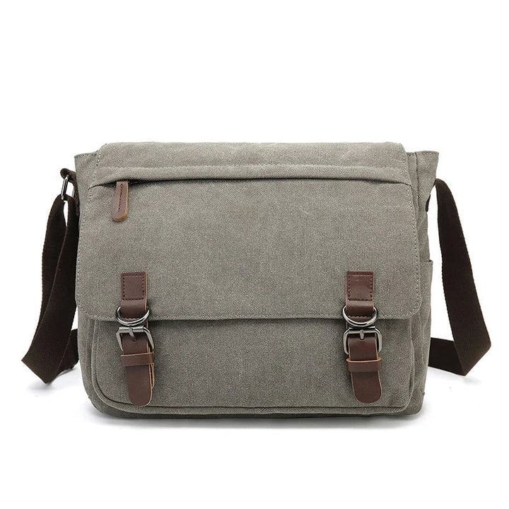 Robuuste heren schoudertas van canvas, ideaal voor dagelijks comfort. Perfect als werktas, reistas of crossbody.