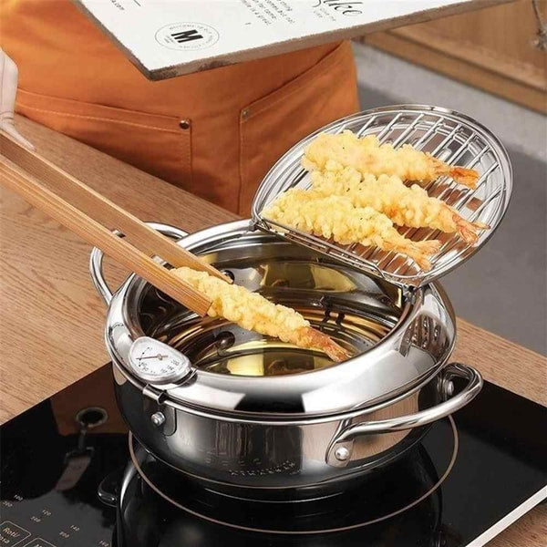 Roestvrijstalen friteuse met ingebouwde thermometer, ideaal voor nauwkeurig frituren thuis.