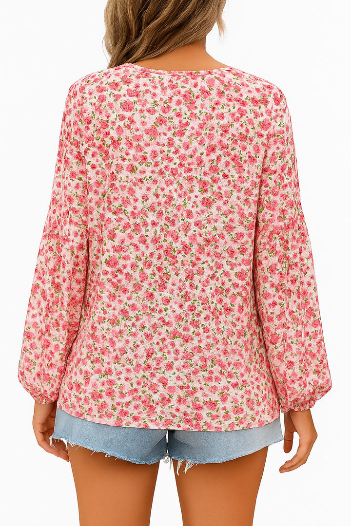 "Roze bloemenblouse met V-hals en lange mouwen, vrouwelijke look voor lente- en zomerdagen."