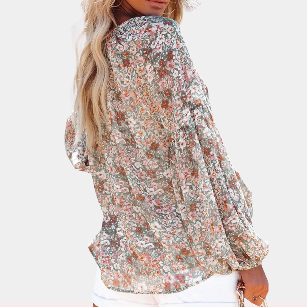 "Roze bloemenblouse met V-hals en lange mouwen, vrouwelijke look voor lente- en zomerdagen."