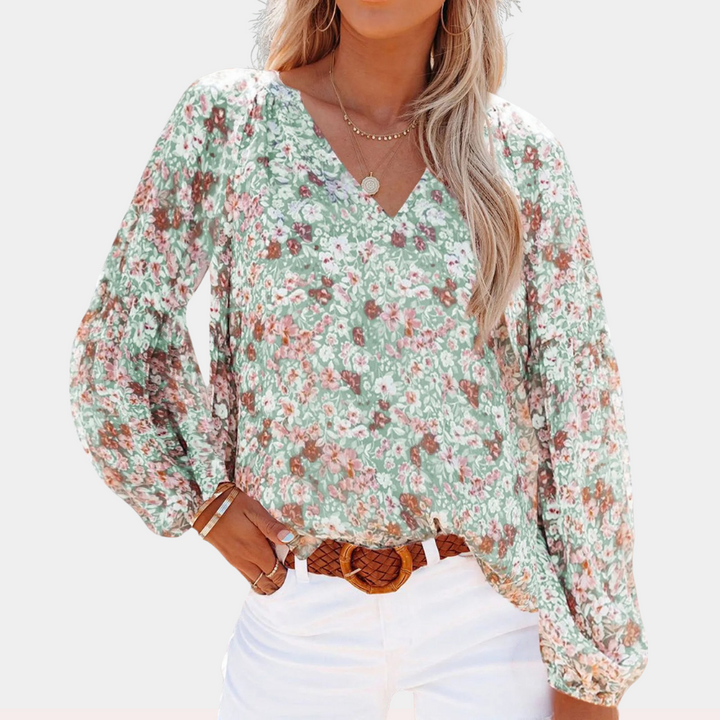 "Roze bloemenblouse met V-hals en lange mouwen, vrouwelijke look voor lente- en zomerdagen."