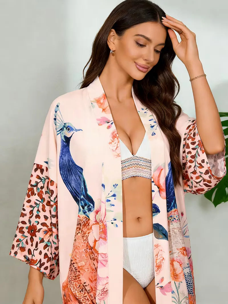Lange kimono cover-up met roze bloemenprint, bohemian stijl, perfect voor dames strandmode.