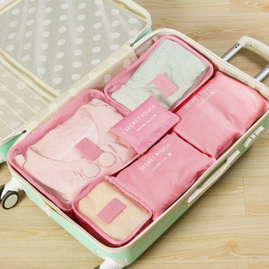 Multifunctionele bagage organizer set: diverse formaten voor kleding en accessoires.
