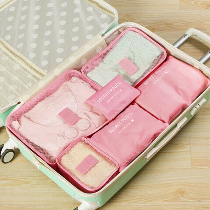 Multifunctionele bagage organizer set: diverse formaten voor kleding en accessoires.