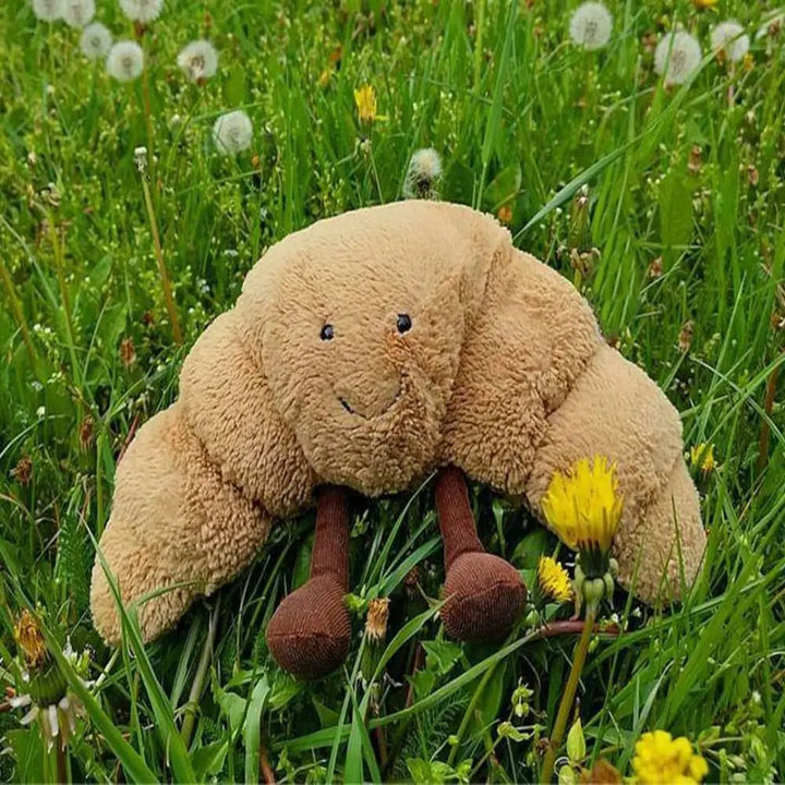 Schattige pluchen croissant knuffel met lachend gezicht, kort pluche en PP-katoen, perfecte decoratie of cadeau.
