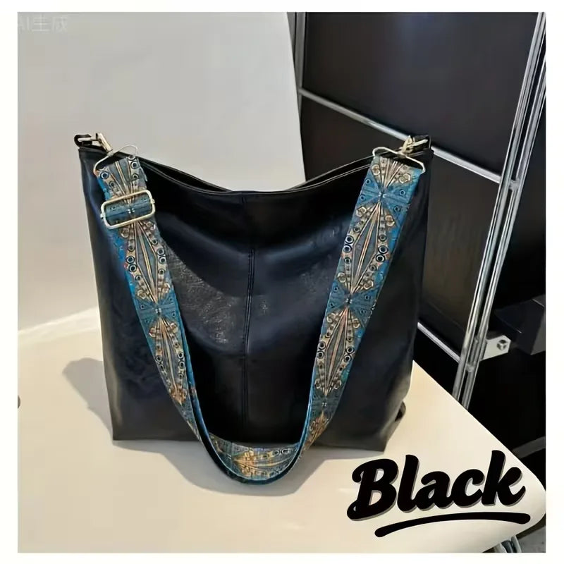 Modieuze dames schoudertas met opvallende kleurrijke strap. Ideaal als casual, bohemian of praktische dagelijkse tas.