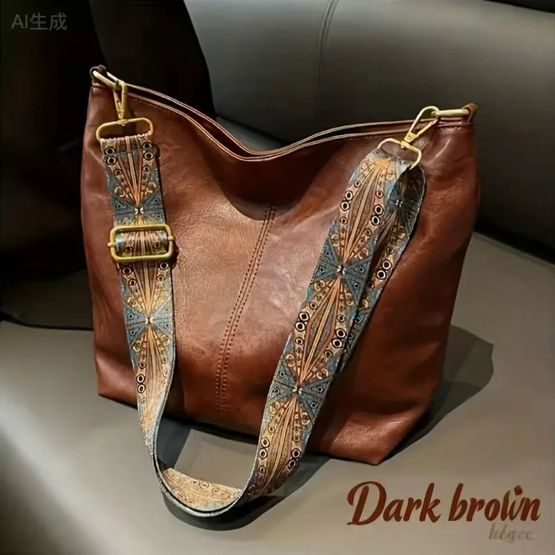 Comfortabele schoudertas met verstelbare kleurrijke band. Perfect als dagelijkse tas of praktische reistas voor dames.