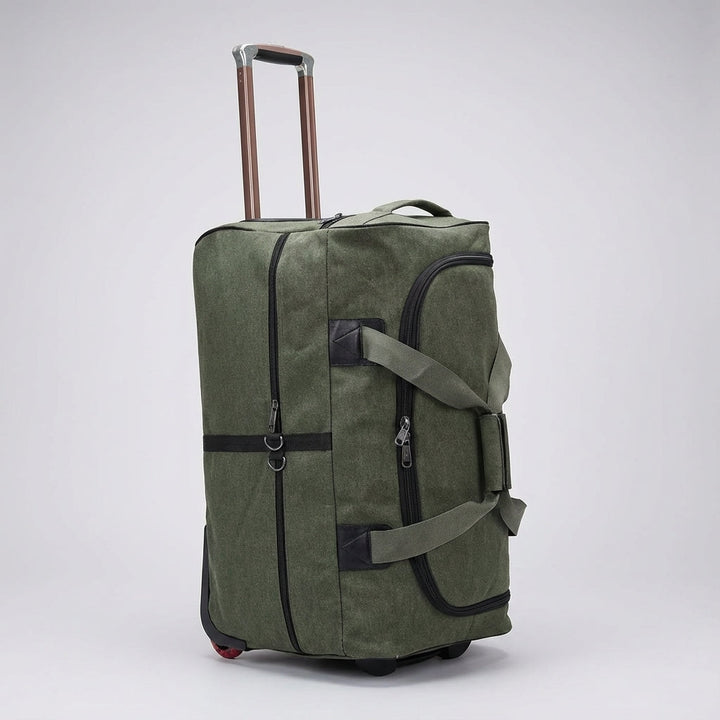Dikke canvas reistas met soepel rollende wielen, ontworpen voor comfortabel transport van zware bagage.