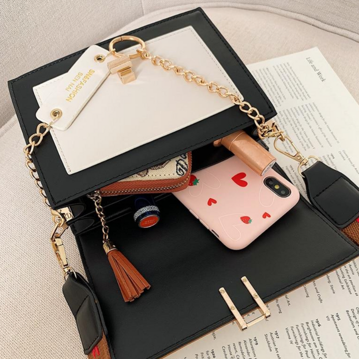 Compact Sana dames handtasje over de schouder, een veelzijdige en elegante accessoire voor elke dag.