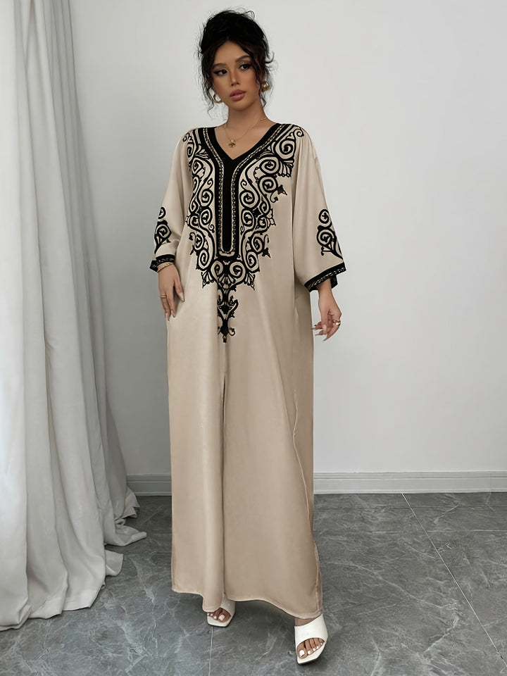 "Stijlvolle abaya jurk met V-hals, lange mouwen en kleurrijke etnische print, voor een elegante en culturele look."
