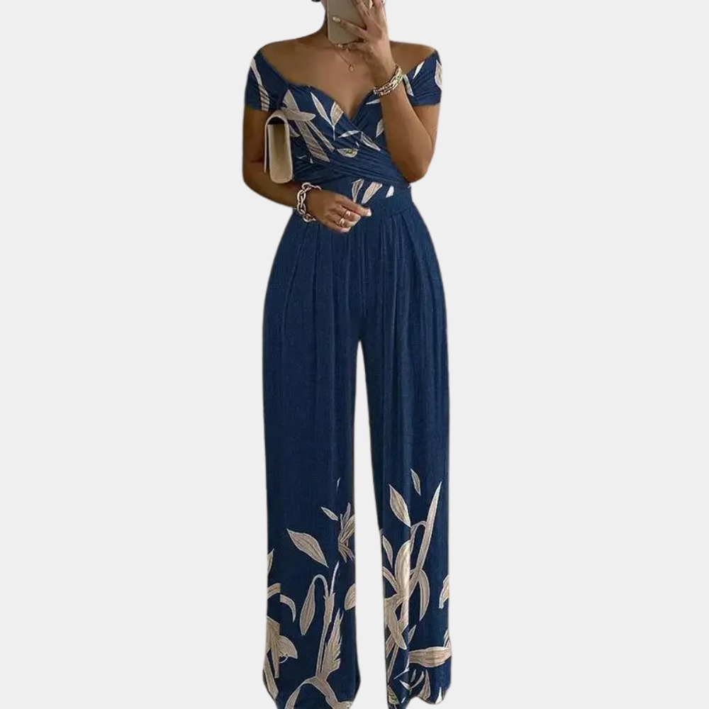 "Stijlvolle dames jumpsuit met blauwe print, elegante snit en stretchmateriaal voor comfortabele, flatterende pasvorm."