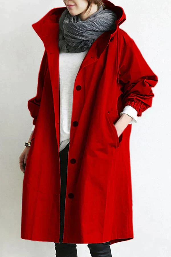 Stijlvolle dames regenjas met capuchon, wind- en waterdicht, lange pasvorm. Elegante details voor dagelijks gebruik.
