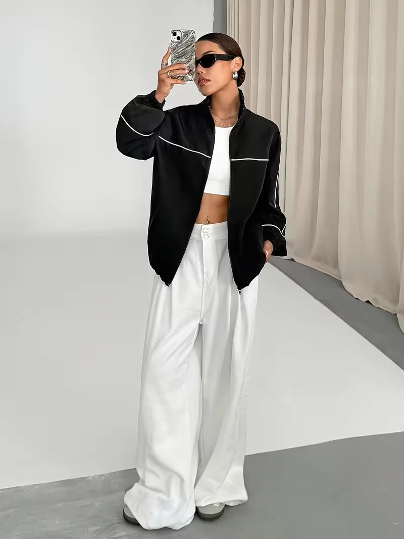 Comfortabele zwarte dames track jacket met hoge kraag, perfect als lente of herfst jas.