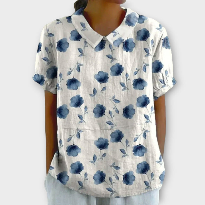 Stijlvolle damesblouse met bloemenprint, perfect voor zonnige dagen en biedt moeiteloze elegantie en comfort.