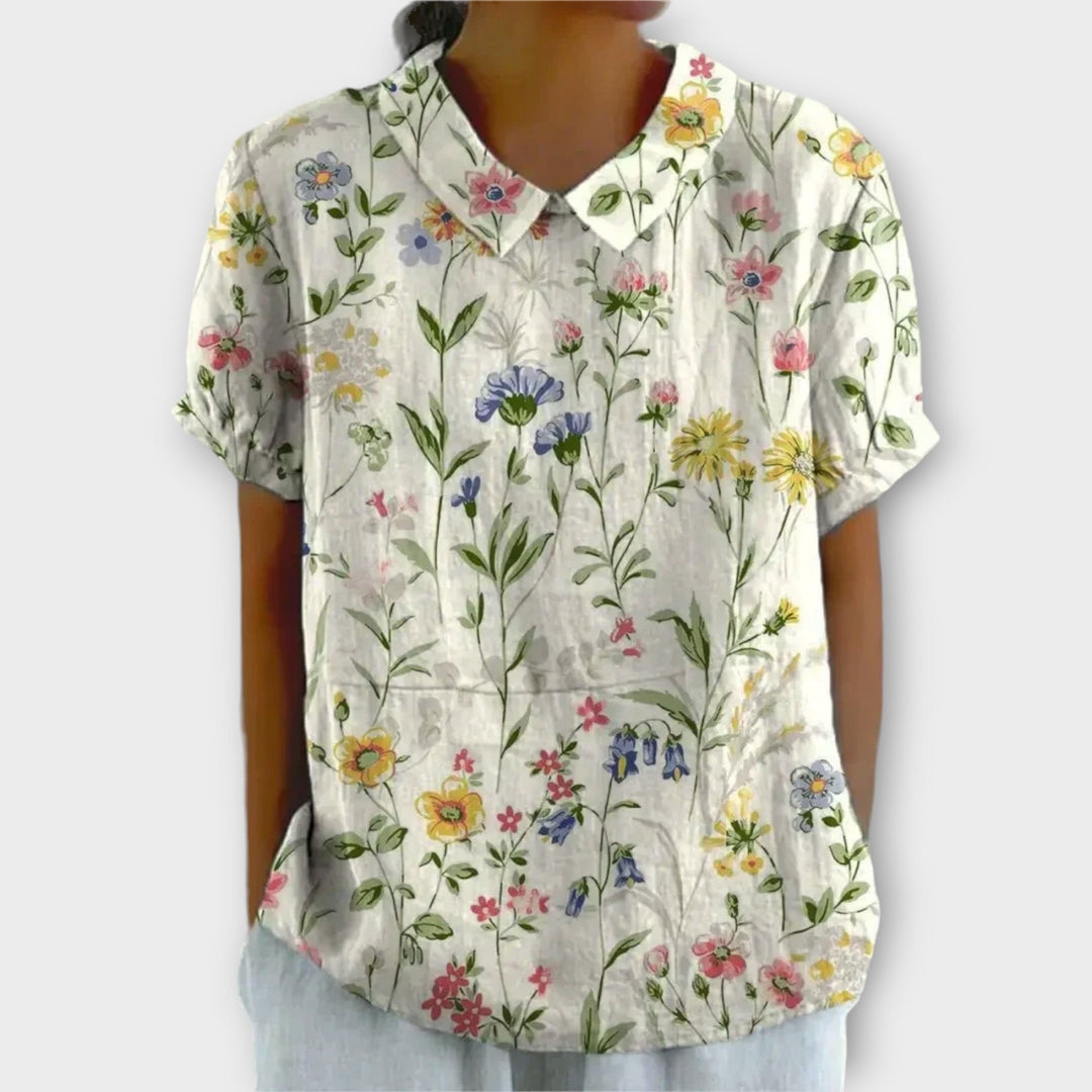 Stijlvolle damesblouse met bloemenprint, perfect voor zonnige dagen en biedt moeiteloze elegantie en comfort.