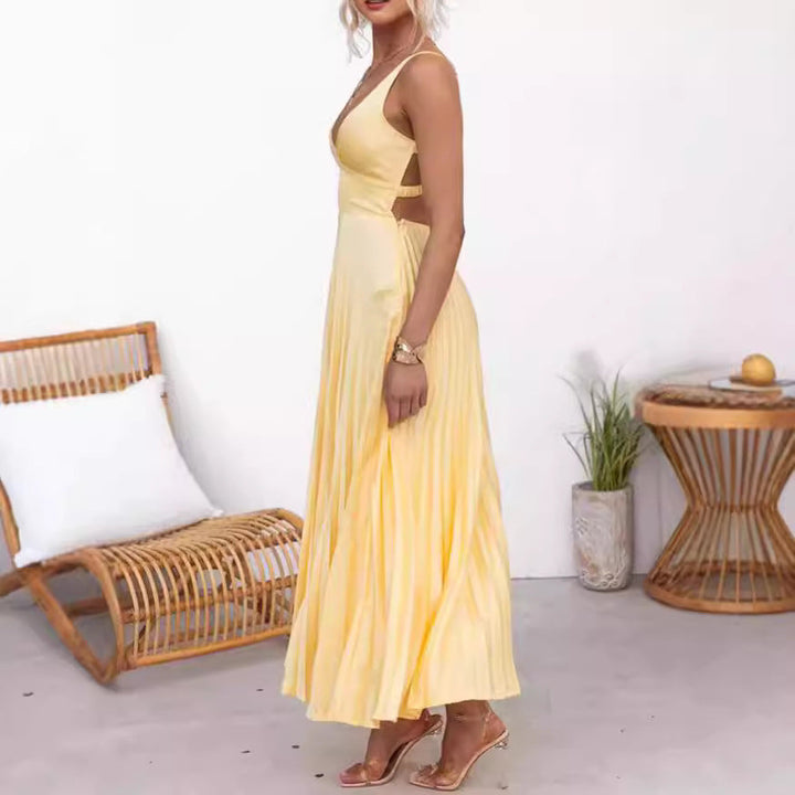 Comfortabele gele plissé dames maxi jurk, ideaal als elegante zomer- of vakantiejurk.