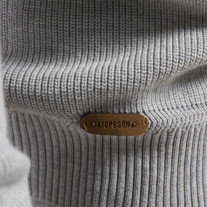 Veelzijdige heren sweater met half-zip kraag en karakteristieke ribgebreide mouwen voor elke gelegenheid.