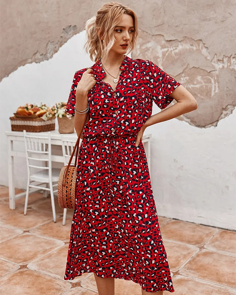 Luchtige midi dames zomerjurk met korte mouwen; stijlvol en comfortabel voor warme dagen.
