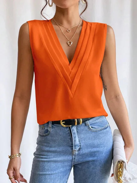 "Stijlvolle mouwloze blouse met V-hals, luchtige pasvorm. Perfect voor warme dagen, combineer met casual of formele outfits."