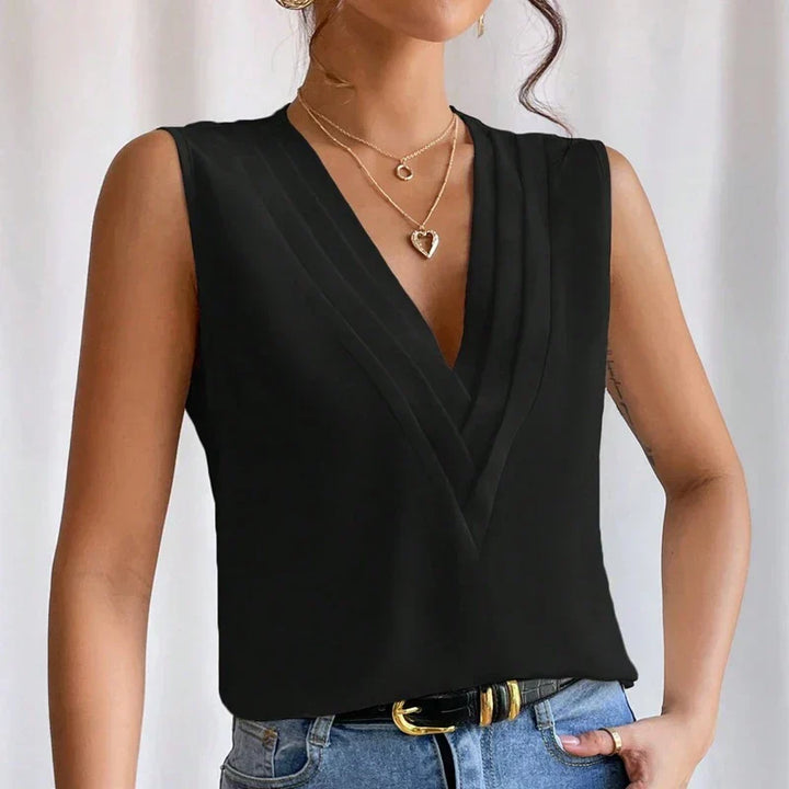 "Stijlvolle mouwloze blouse met V-hals, luchtige pasvorm. Perfect voor warme dagen, combineer met casual of formele outfits."