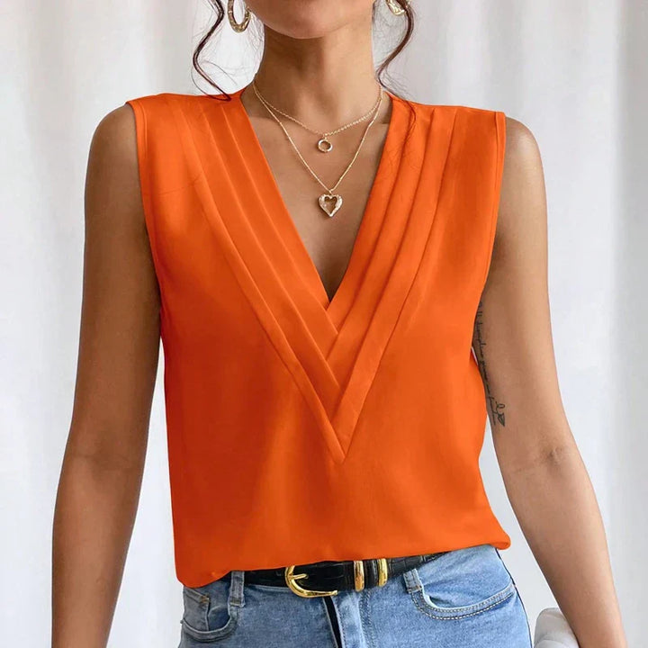 "Stijlvolle mouwloze blouse met V-hals, luchtige pasvorm. Perfect voor warme dagen, combineer met casual of formele outfits."