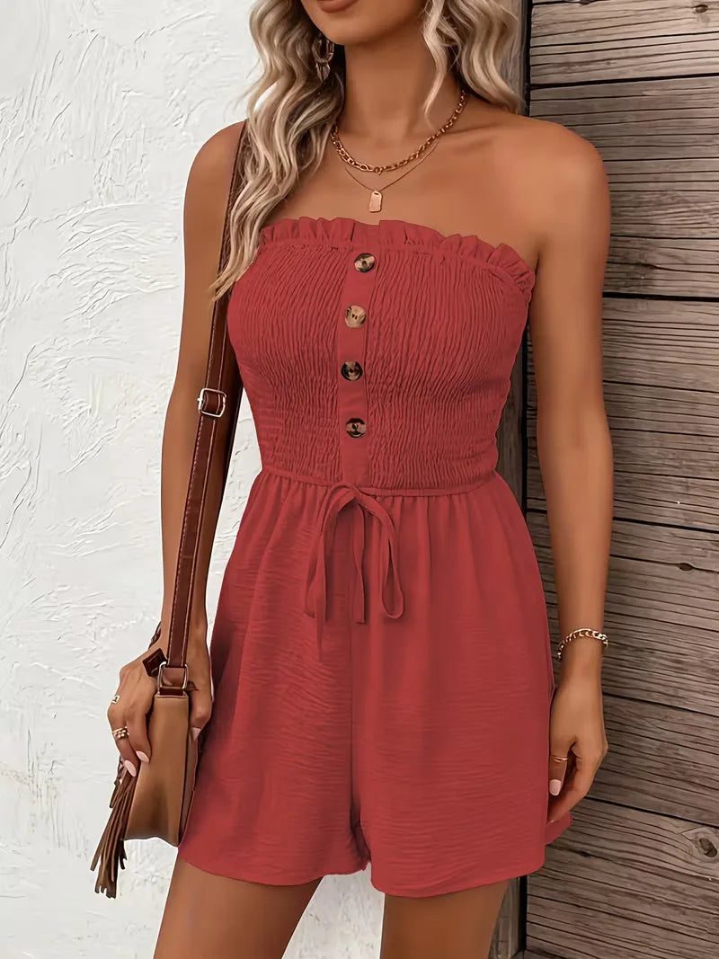 Modieuze strapless dames playsuit, wijde pijpen, strikdetail, trendy zomerstijl.