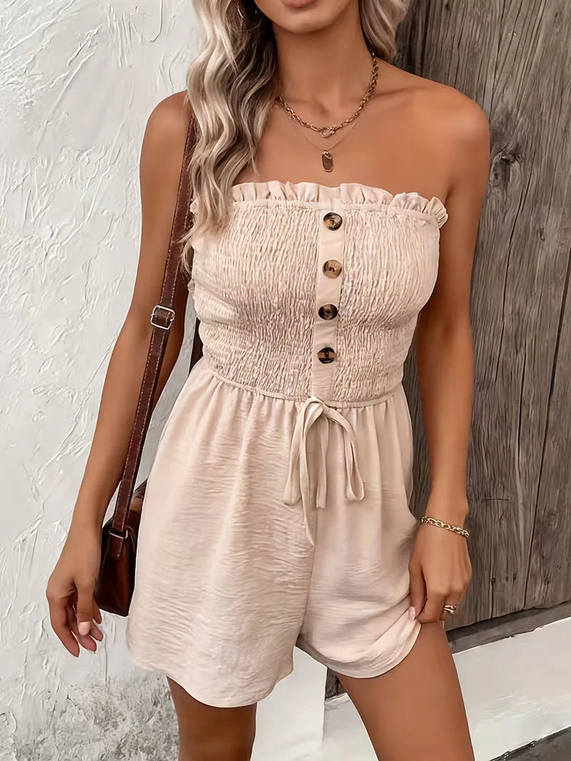 Casual strapless playsuit met strikdetail en wijde pijpen, comfortabele vakantieoutfit.