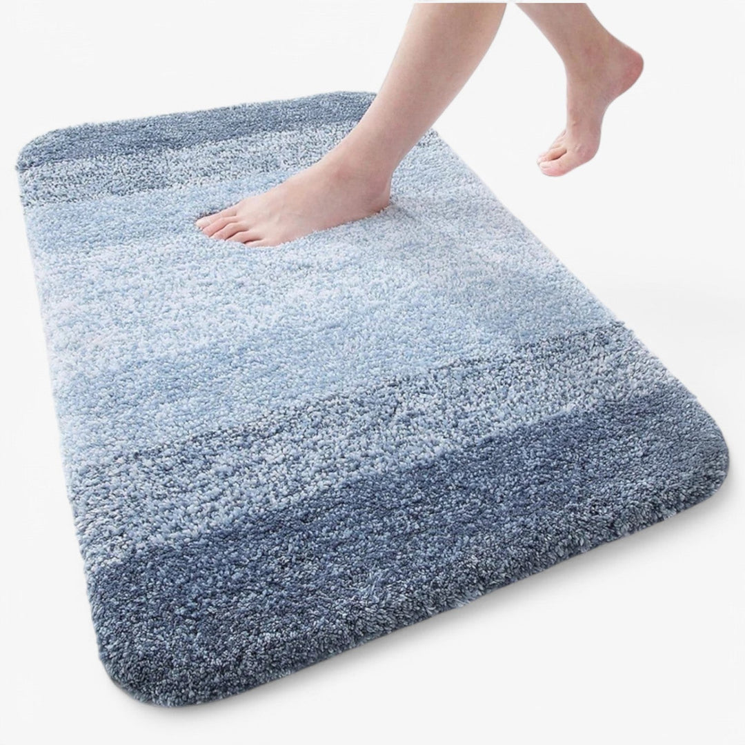 "Super absorberende antislip badmat met sneldrogende microvezels, zacht blauw oppervlak, ideaal voor badkamercomfort."