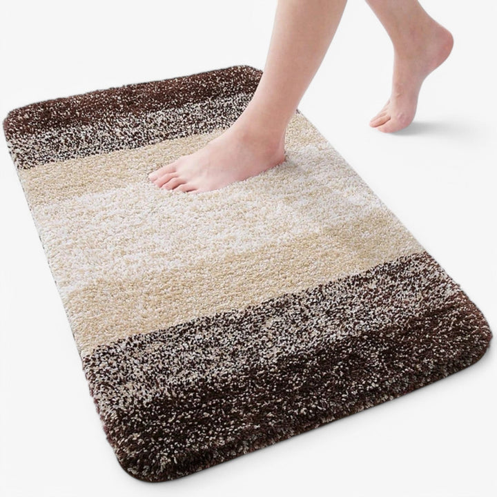 Wasbare badmat, opgevouwen om de kwaliteit en dikte van de absorberende microvezel te tonen.