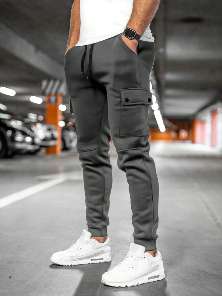 Heren joggingbroek met stijlvolle zak, tapered pasvorm. Comfortabele stretchstof voor een moderne, casual look.