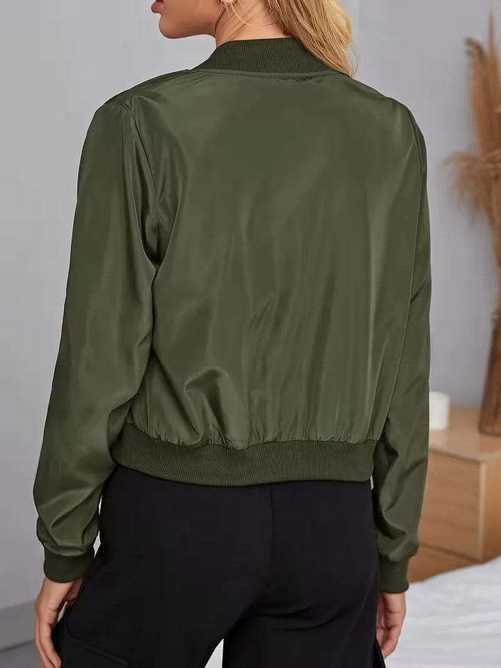 Legergroen dames bomberjack, regular fit, met stijlvolle ribgebreide boorden en ritssluiting.