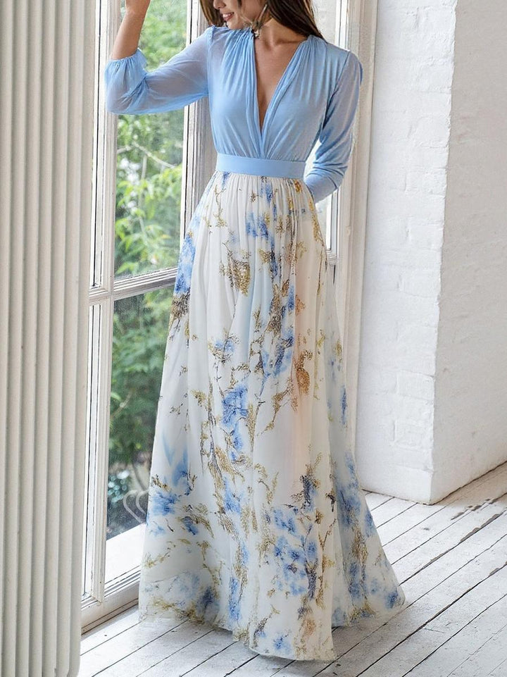 Trendy lange chiffon jurk met V-hals en bloemenprint, elegant en zwierig ideaal voor speciale gelegenheden.