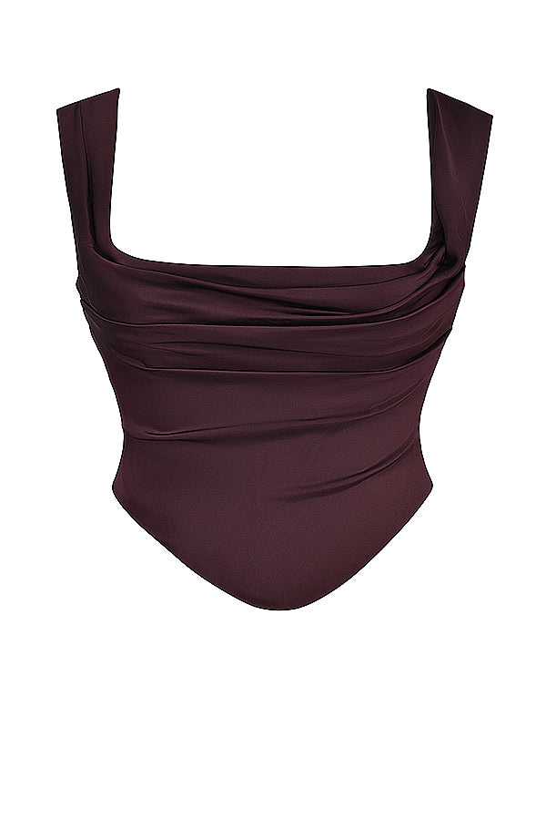 "Tweedelige satijnen corset-top en maxirok set, elegant ontwerp in rijke tinten, perfect voor formele gelegenheden."