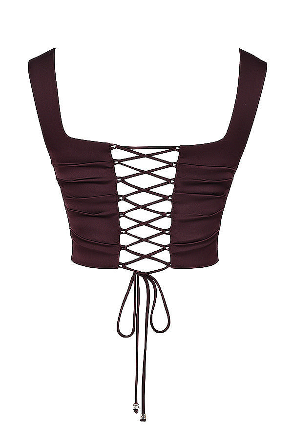 "Tweedelige satijnen corset-top en maxirok set, elegant ontwerp in rijke tinten, perfect voor formele gelegenheden."