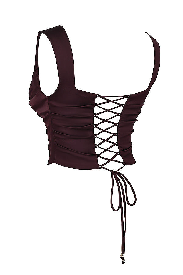 "Tweedelige satijnen corset-top en maxirok set, elegant ontwerp in rijke tinten, perfect voor formele gelegenheden."