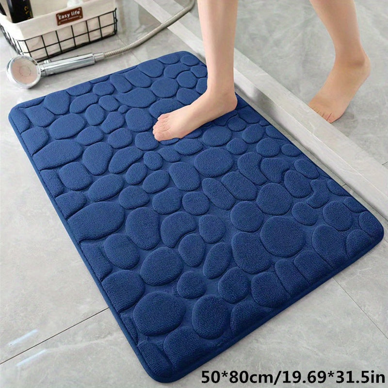 Rechthoekige badmat, super absorberend en antislip, in een strakke, minimalistische badkamer.