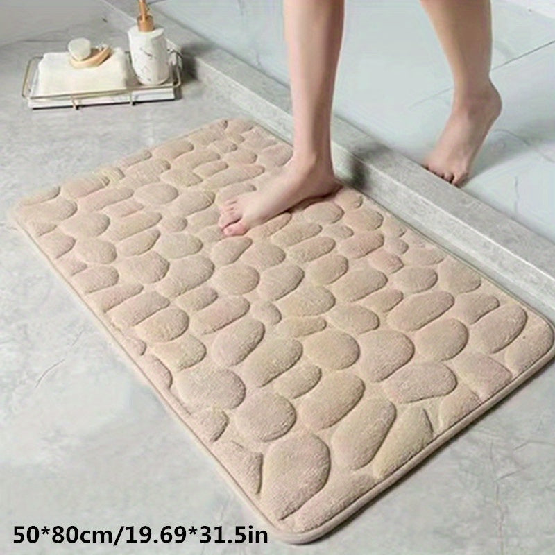 Opgerolde, compacte antislip badmat toont de zachte stof en de handige opbergmogelijkheid.