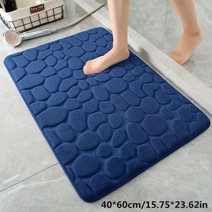 Close-up van de antislip onderkant van de badmat, rubberen grip voor maximale veiligheid.