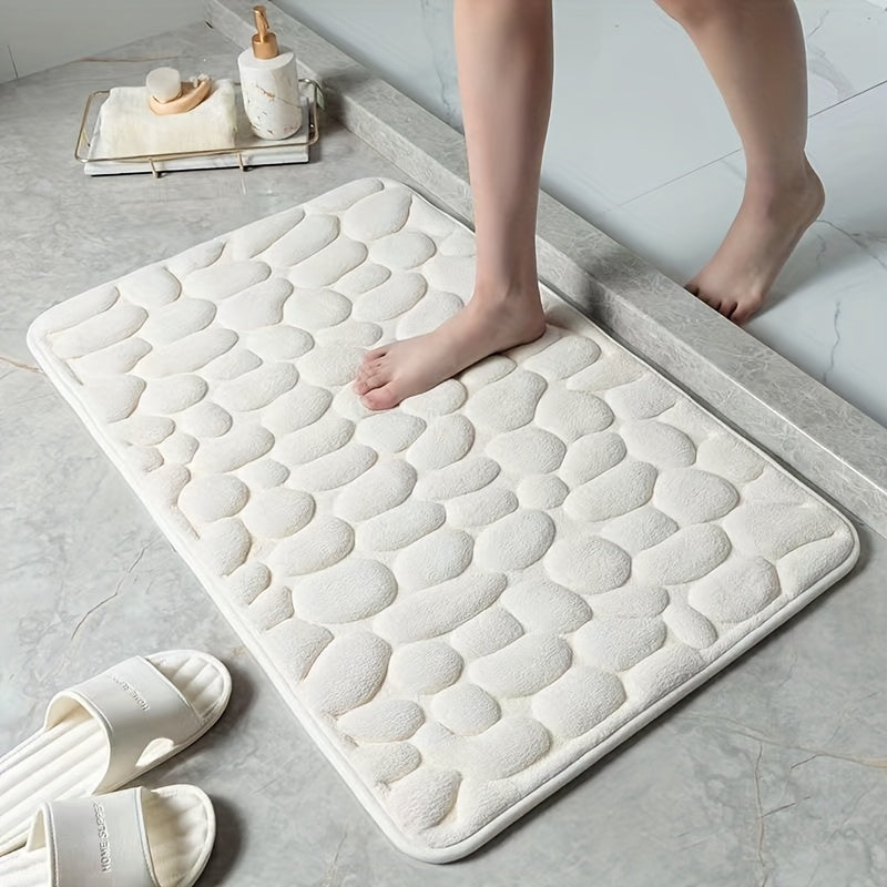 Zachte polyester badmat in neutrale kleur voor extra comfort en goede absorptie in de badkamer.